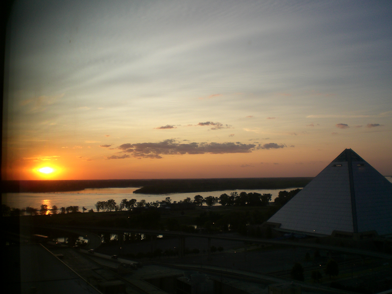 overview of Memphis (USA) pyramid and sunset over the Mississippi River